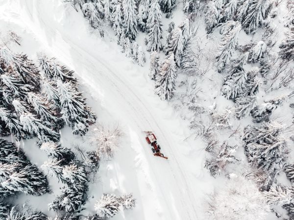 Aerial Drone Shot of a Snowy Road Free Stock Photo