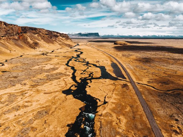 Icelandic Road next to a River Free Photo