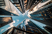 Looking directly up at the skyline of the financial district in central London - stock image