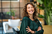 Beautiful woman smiling with crossed arms