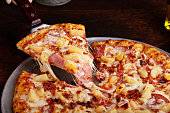 Hawaiian pizza with ham and pineapple