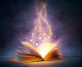 Magic Book With Open Pages And Abstract Lights Shining In Darkness - Literature And Fairytale Concept