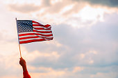 Hand Waving the Flag of the United Stated of America