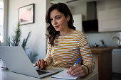 Young woman working at home