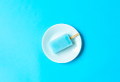 Popsicles on the light blue background.