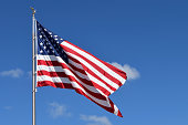 USA flag on blue sky background