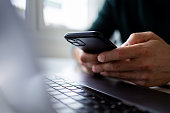 Close up on man hand using mobile phone