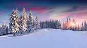 Panorama of the winter sunrise in mountains