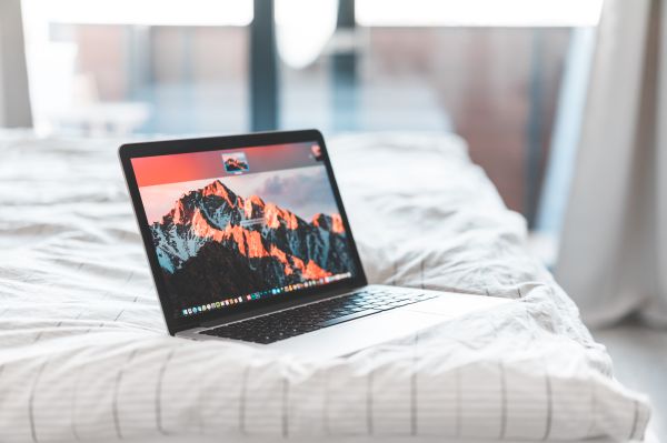 Laptop in Bed Free Photo