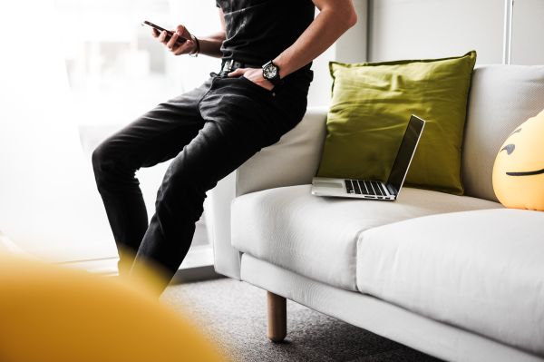 Man Using His Smartphone in the Office Free Photo