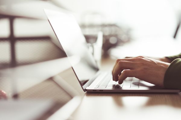 Millennial Guy Working on His Laptop Free Stock Photo