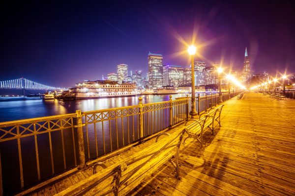 Old Pier and San Francisco Skyline with Bay Bridge at Night Free Photo