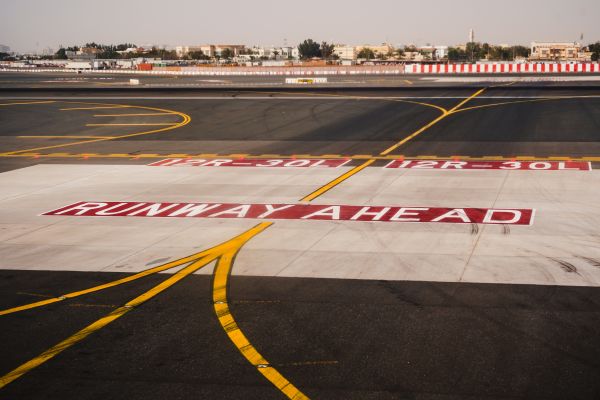 Runway Ahead Sign on Runway at Airport Free Photo