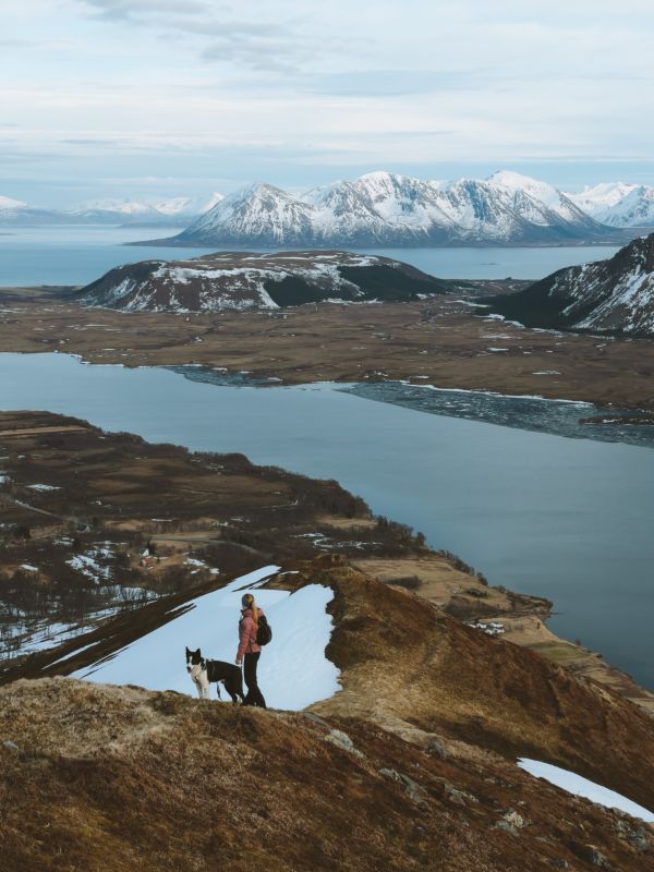 Woman Hiking with Husky Dog and Enjoying the View Free Photo