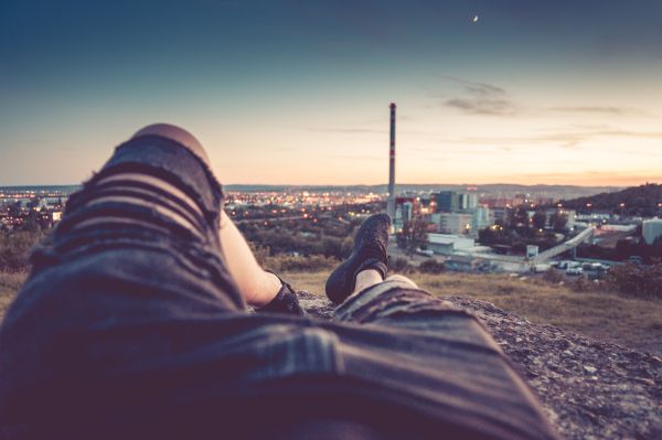 Young Man Chilling and Enjoying Evening Cityscape View Free Photo